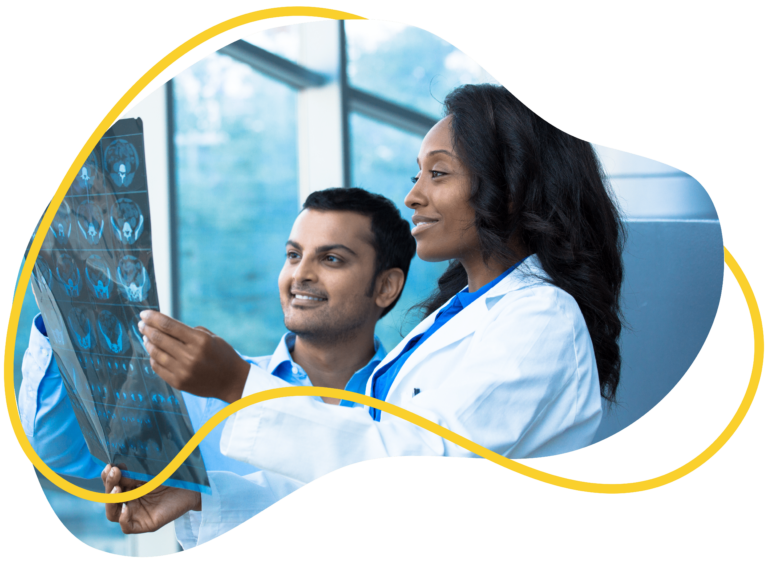 Healthcare Professionals Looking At Full Body X-Ray Radiographic Image